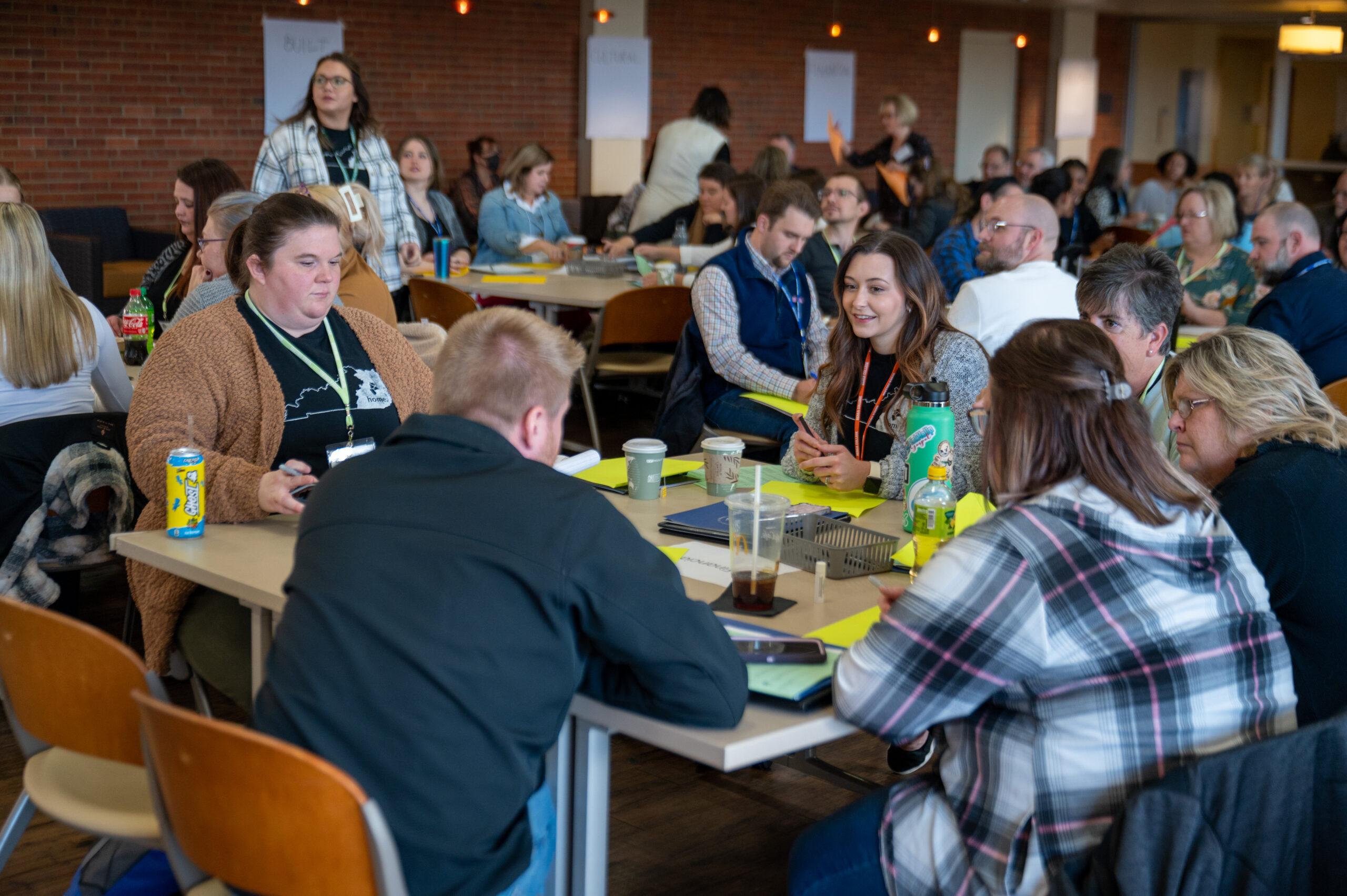 participants talking around table at Leadership Gathering